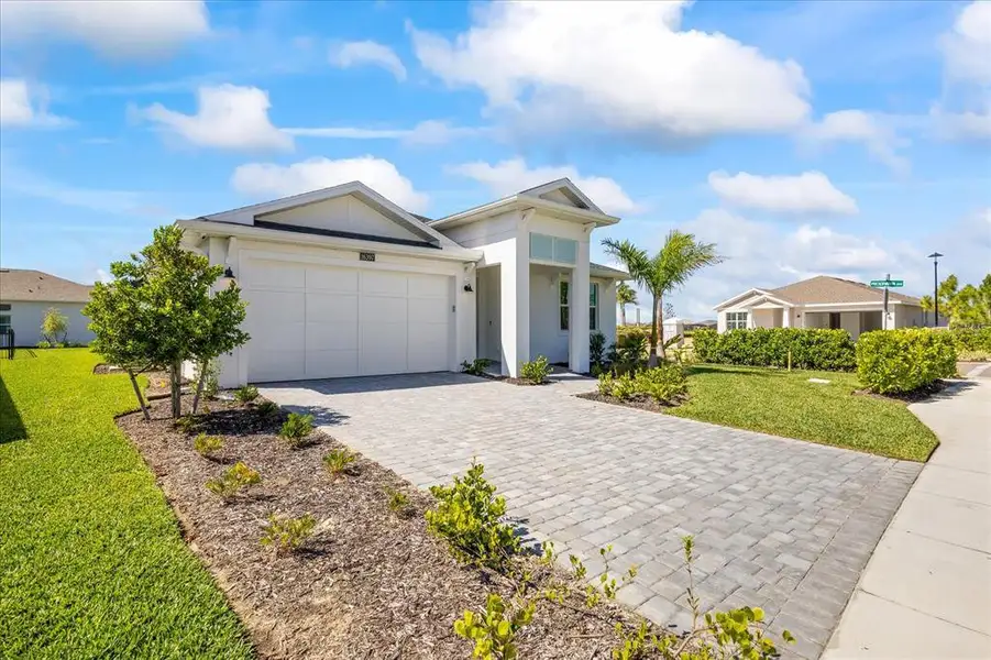 Front exterior of a new home in , Punta Gorda, FL, highlighting curb appeal (Image 2).