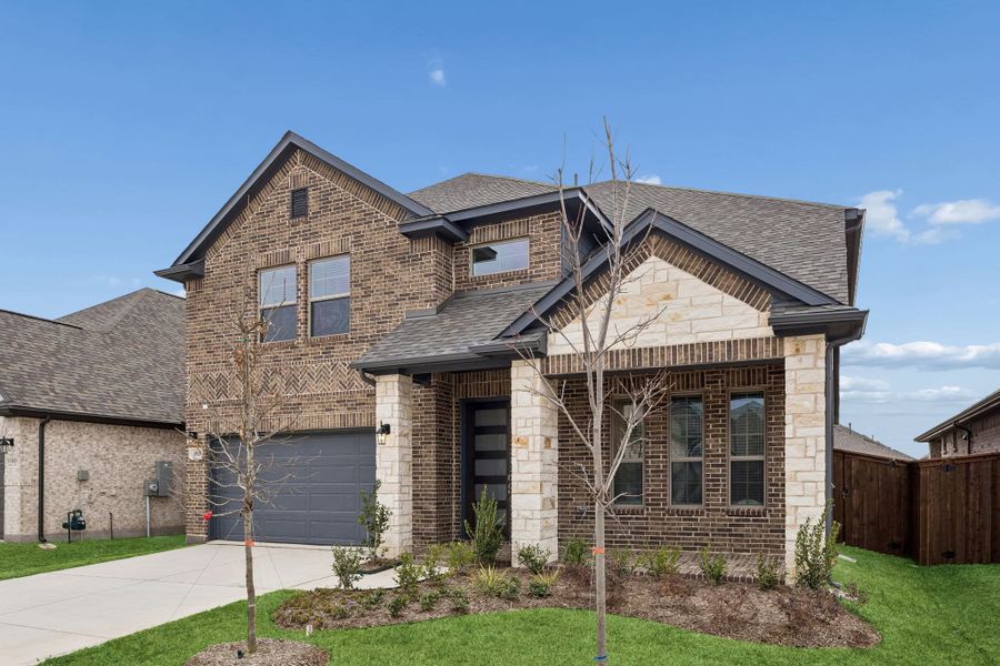 Front exterior of a new home in Las Lomas, Forney, TX, highlighting curb appeal (Image 23).