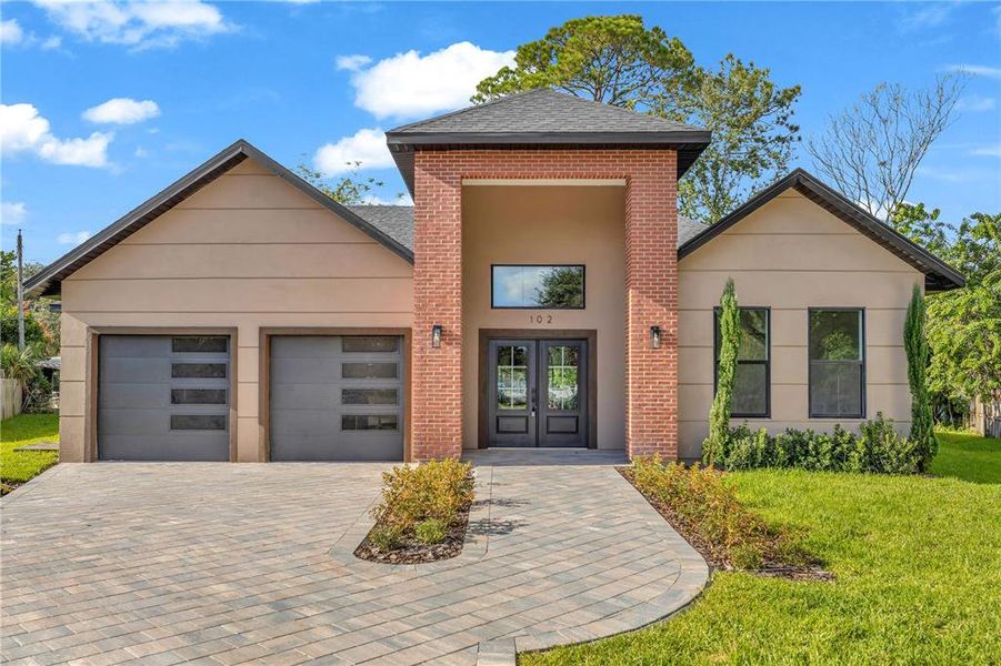 Front exterior of a new home in , Winter Park, FL, highlighting curb appeal (Image 1).