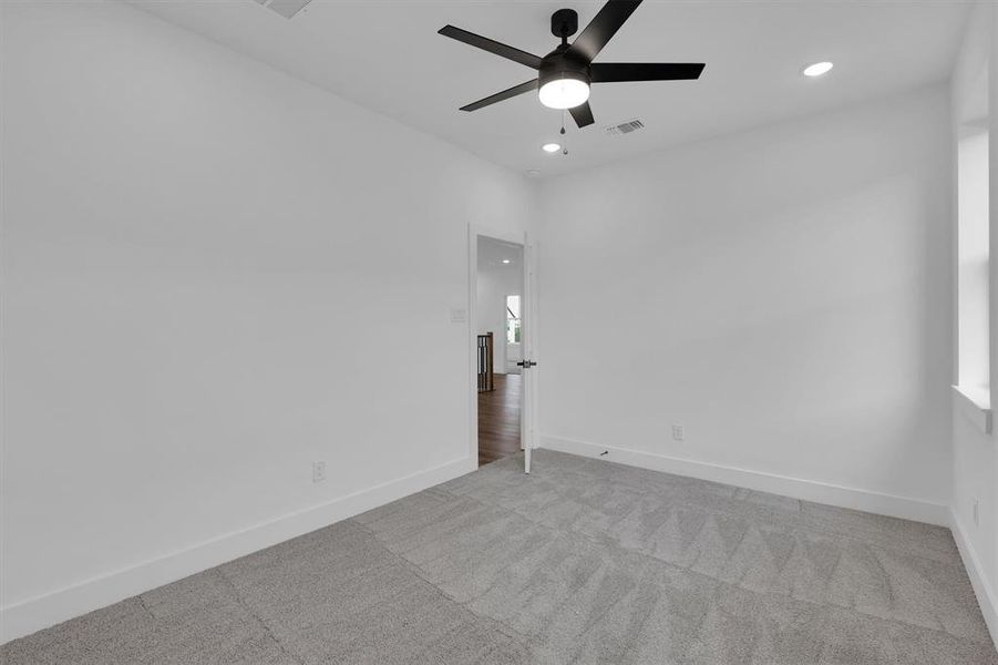 Spare room featuring ceiling fan, recessed lighting, and carpet Spare room featuring ceiling fan, recessed lighting, and carpet