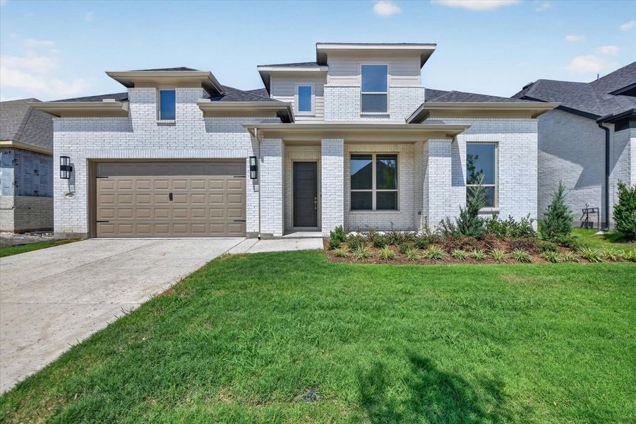 Front exterior of a new home in Goodland, Midlothian, TX, highlighting curb appeal (Image 1). Front exterior of a new home in Goodland, Midlothian, TX, highlighting curb appeal (Image 1).