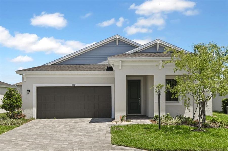 Front exterior of a new home in Cherrywood Preserve, Ocala, FL, highlighting curb appeal (Image 2).