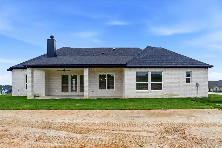 Exterior details and patio area of a home in , Springtown (Image 4).