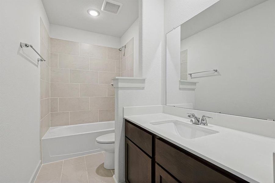 Bathroom with vanity and washtub / shower combination Bathroom with vanity and washtub / shower combination