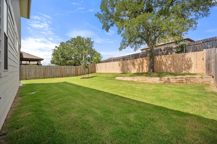 Front exterior of a new home in The Hills of Bear Creek, Manchaca, TX, highlighting curb appeal (Image 19).