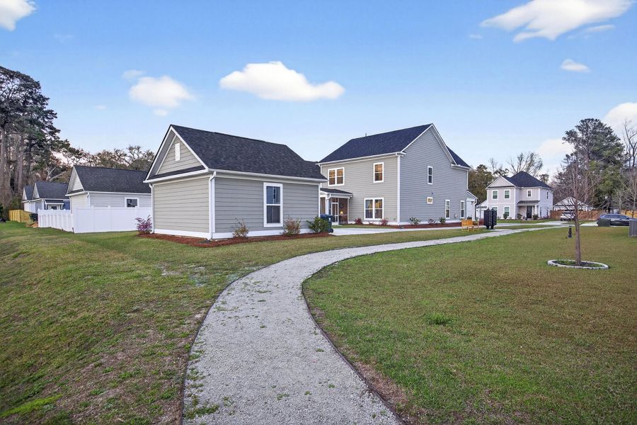 Front exterior of a new home in Pineland Village, Summerville, SC, highlighting curb appeal (Image 27).