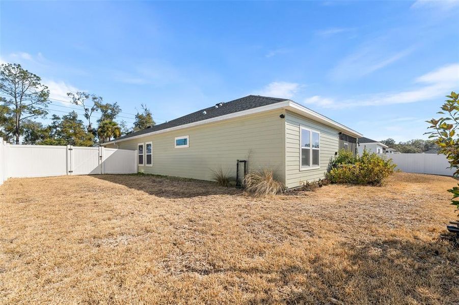 Exterior details and patio area of a home in Country Lane Estates, Williston (Image 4).