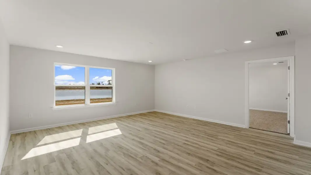 Spacious, unfurnished interior of a new home in Magnolia at the Bluffs Phase 3, Freeport (Image 14). Spacious, unfurnished interior of a new home in Magnolia at the Bluffs Phase 3, Freeport (Image 14).