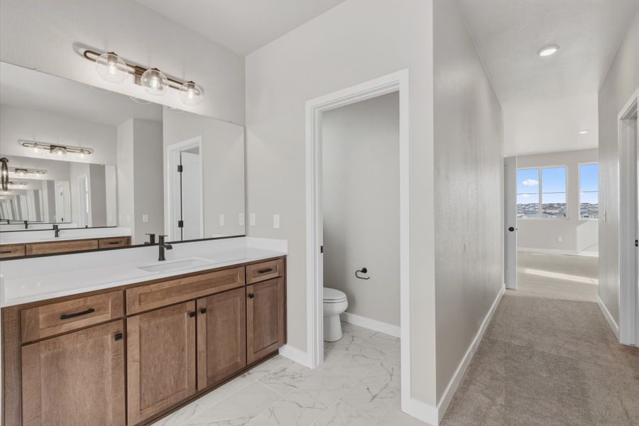 Furnished interior view inside a new home in The Aurora Highlands, Aurora (Image 9).