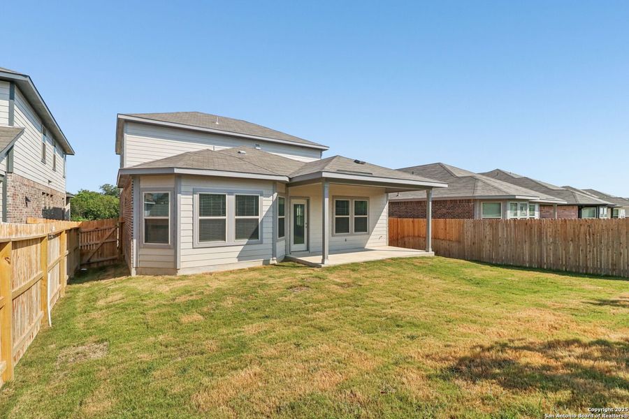 Front exterior of a new home in Comanche Ridge, San Antonio, TX, highlighting curb appeal (Image 2). Front exterior of a new home in Comanche Ridge, San Antonio, TX, highlighting curb appeal (Image 2).