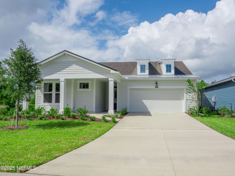 Front exterior of a new home in RiverTown - WaterSong, St. Johns, FL, highlighting curb appeal (Image 10).