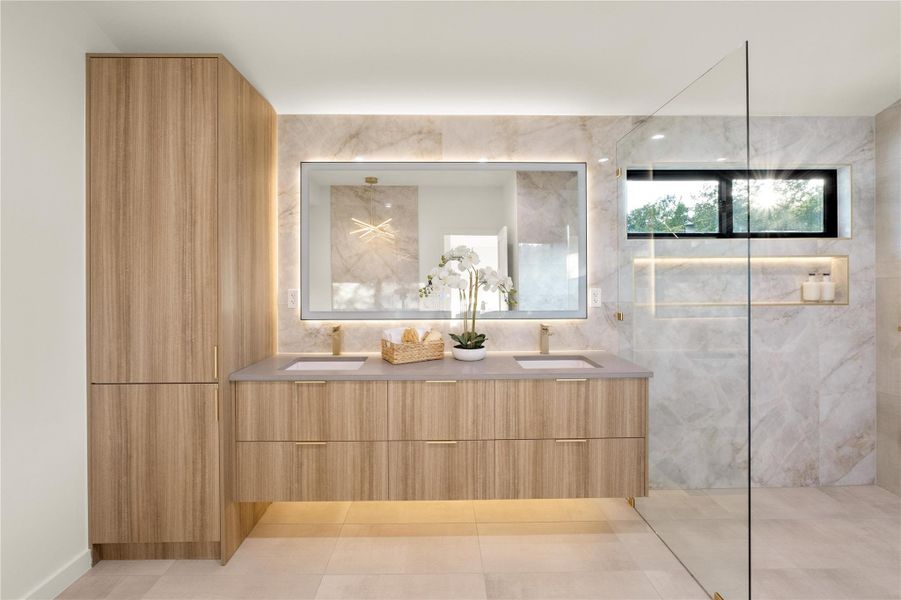 Bathroom featuring double vanity, tile patterned floors, and walk in shower and soaking tub