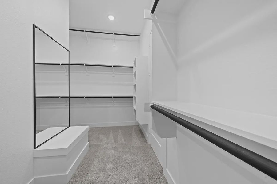 Representative furnished interior of a home built from the Summerton by Chesmar Homes in University Heights, Round Rock (Image 15).