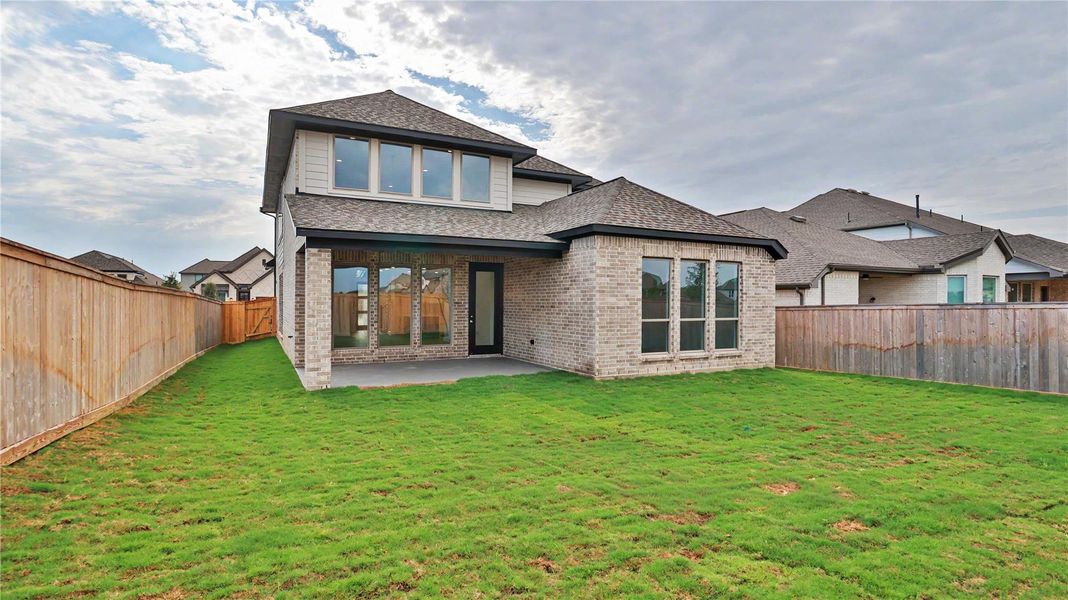 Exterior details and patio area of a home in Bridgeland, Cypress (Image 4).