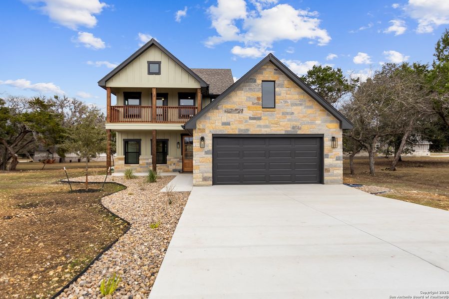 Front exterior of a new home in , Bandera, TX, highlighting curb appeal (Image 1). Front exterior of a new home in , Bandera, TX, highlighting curb appeal (Image 1).