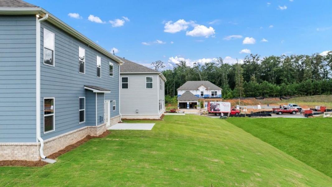 Front exterior of a new home in Butner Estates, South Fulton, GA, highlighting curb appeal (Image 29).