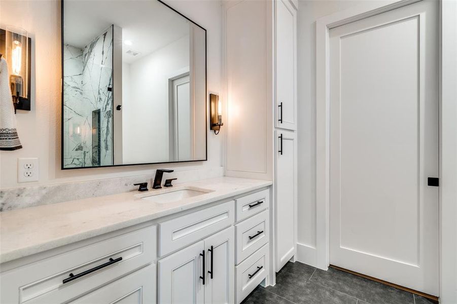 Bathroom with vanity and tile patterned flooring