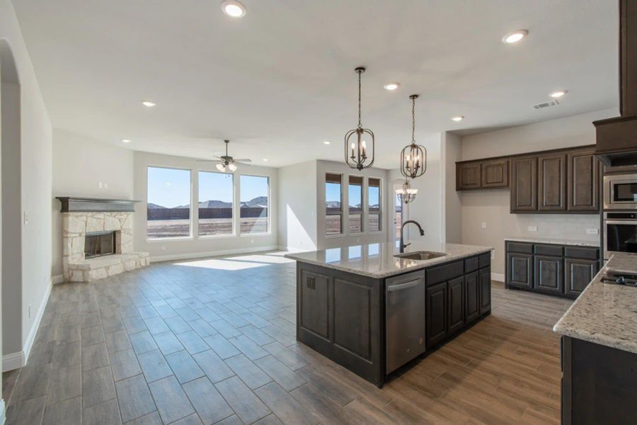 Kitchen & Family Room | Concept 2586 at Hidden Creek Estates in Van Alstyne, TX by Landsea Homes