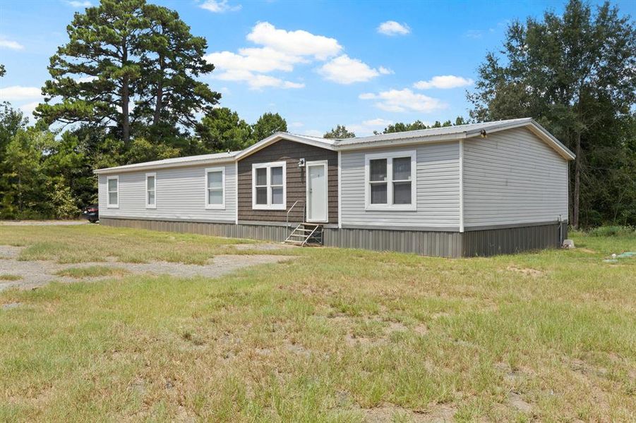 Front exterior of a new home in , Mount Pleasant, TX, highlighting curb appeal (Image 24).
