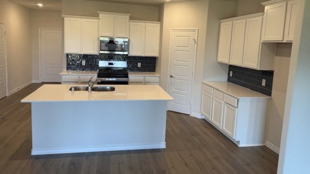 Furnished interior view inside a new home in Fireside by the Lake, Garland (Image 5).