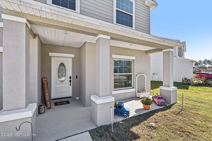 Exterior details and patio area of a home in Village Park, Green Cove Springs (Image 31).