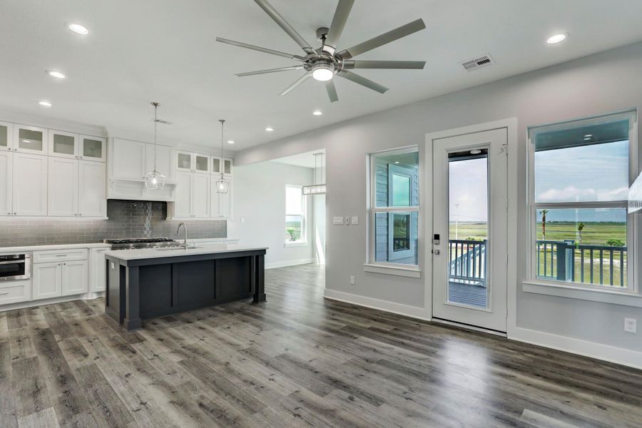 Welcome home!! Open concept living areaa with crisp coastal colors & easy maintenance flooring Welcome home!! Open concept living areaa with crisp coastal colors & easy maintenance flooring
