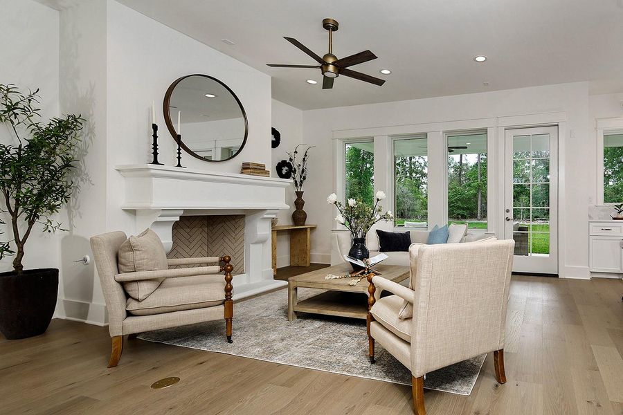 Spacious living room has incredible french oak wood floors with convenient outlets to float your furniture. Views to outdoor lanai and surrounding trees lends to the open airy refreshing ambiance.