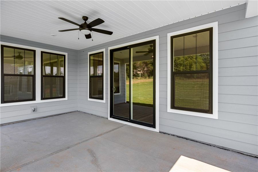 An inviting covered patio seamlessly connects to a