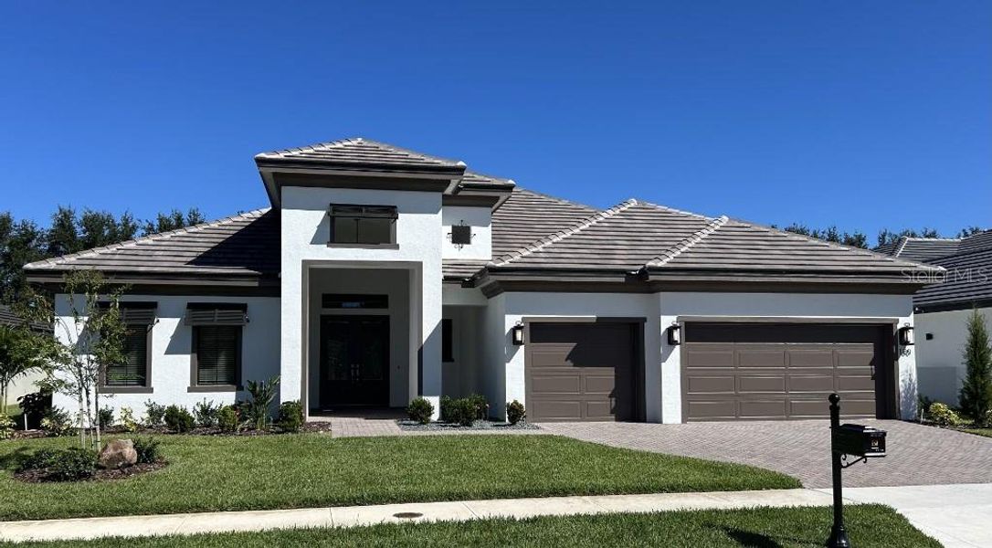 Front exterior of a new home in , Auburndale, FL, highlighting curb appeal (Image 2). Front exterior of a new home in , Auburndale, FL, highlighting curb appeal (Image 2).