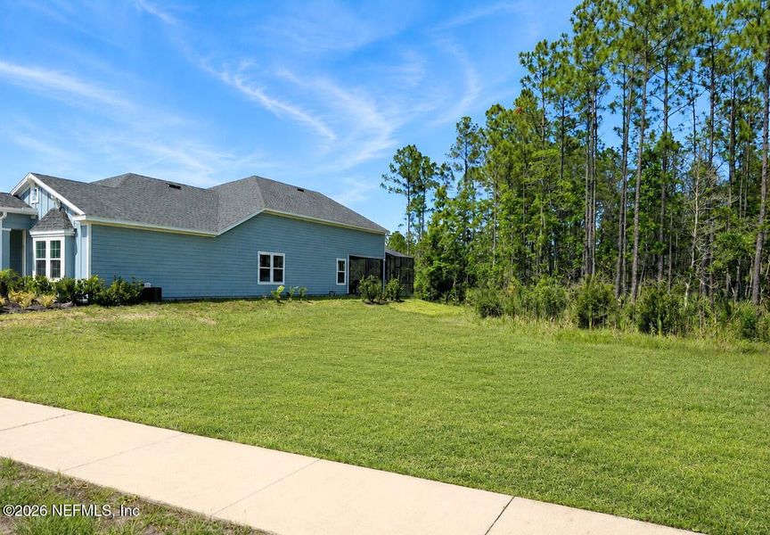 Front exterior of a new home in St Augustine Lakes, St. Augustine, FL, highlighting curb appeal (Image 20). Front exterior of a new home in St Augustine Lakes, St. Augustine, FL, highlighting curb appeal (Image 20).
