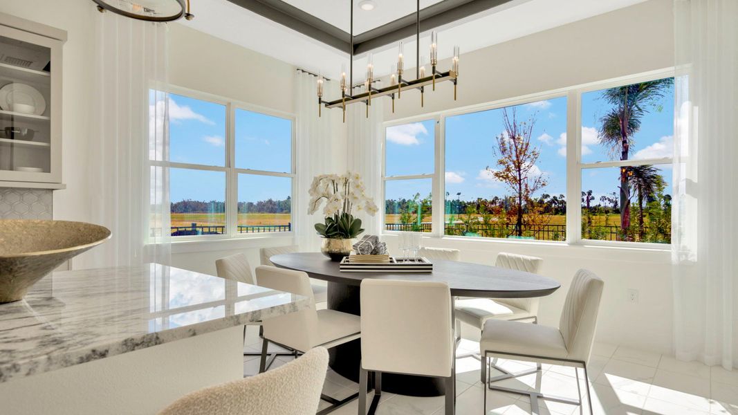 The Dining Room of a DRB Homes Grand Eider model, which is a home plan offered at Serengeti in Spring Hill, FL.