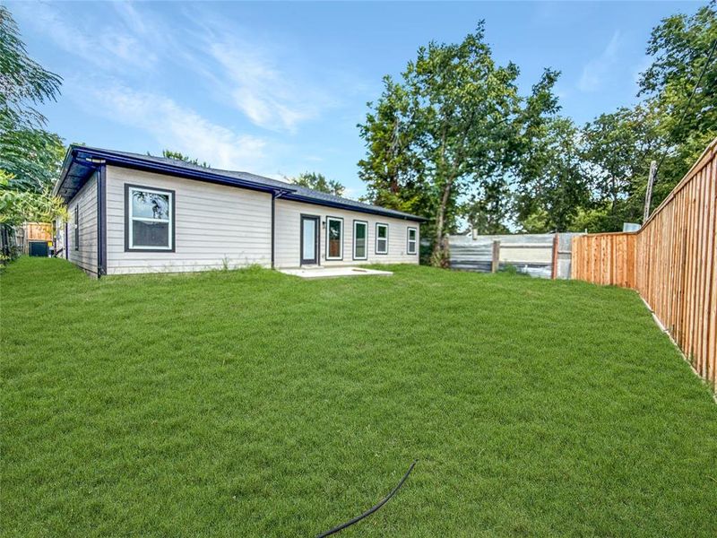 Back of property featuring a patio area and a fenced backyard