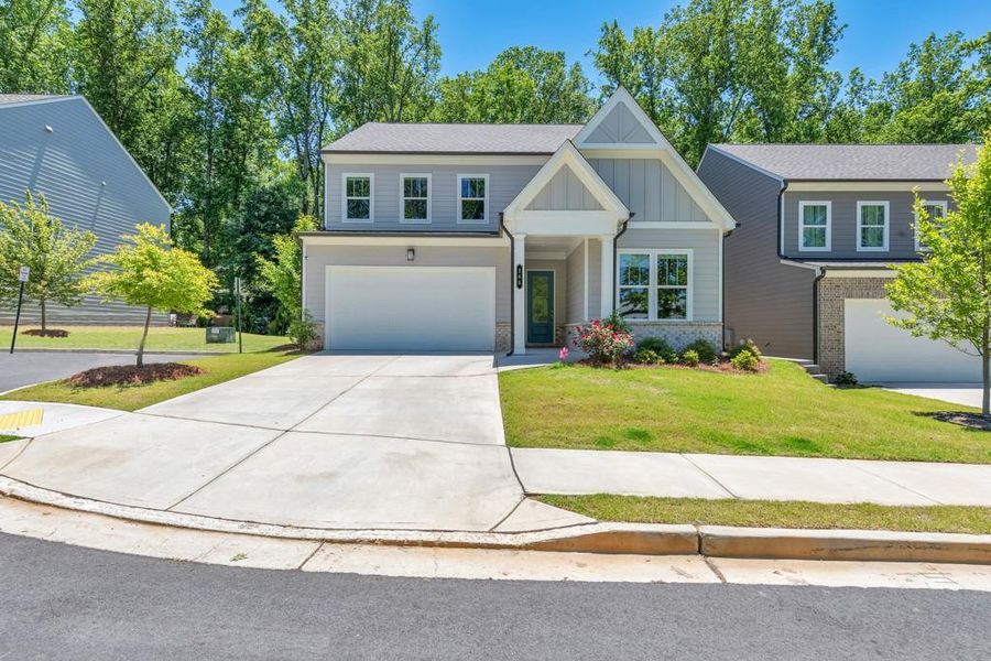 Front exterior of a new home in , Holly Springs, GA, highlighting curb appeal (Image 27). Front exterior of a new home in , Holly Springs, GA, highlighting curb appeal (Image 27).