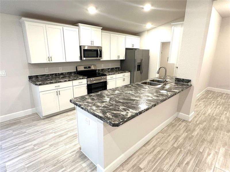 Furnished interior view inside a new home in Oak Hill Plantation, Ocala (Image 4).