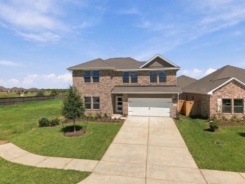 Front exterior of a new home in Windrose Green, Angleton, TX, highlighting curb appeal (Image 19). Front exterior of a new home in Windrose Green, Angleton, TX, highlighting curb appeal (Image 19).