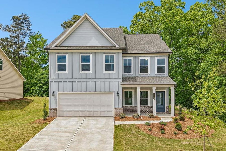 Front exterior of a new home in The Estates at Casteel, Bethlehem, GA, highlighting curb appeal (Image 1). Front exterior of a new home in The Estates at Casteel, Bethlehem, GA, highlighting curb appeal (Image 1).