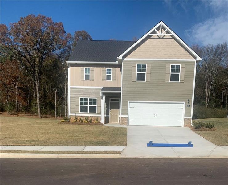 Front exterior of a new home in Jackson Landing, Jefferson, GA, highlighting curb appeal (Image 1).