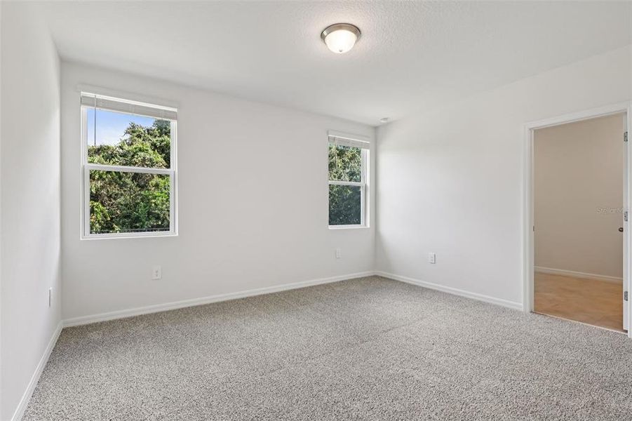 Spacious, unfurnished interior of a new home in Bradbury Creek - Signature Series, Haines City (Image 19).