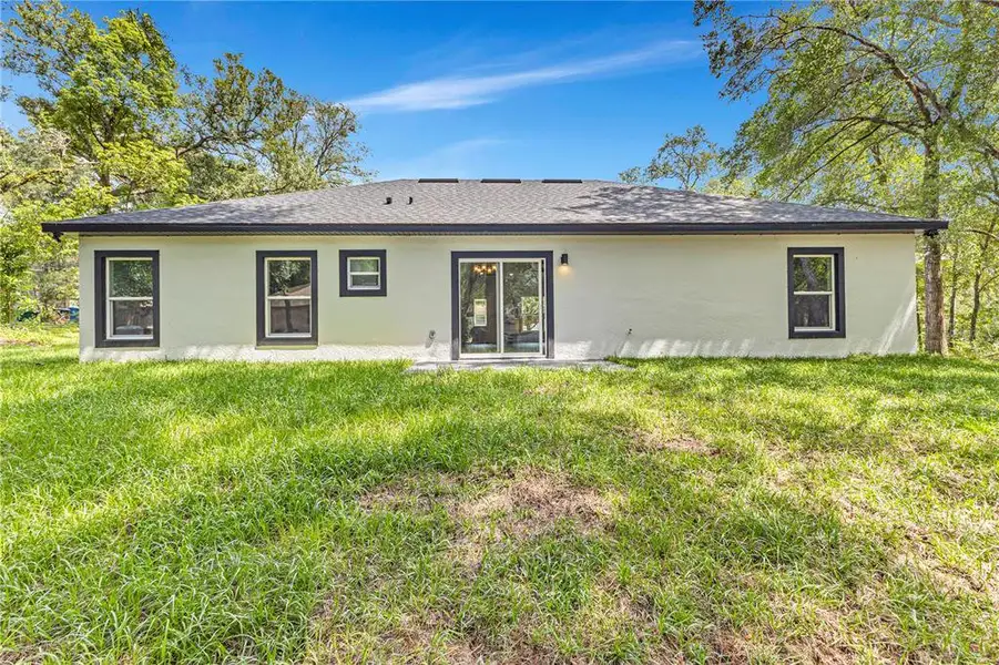 Exterior details and patio area of a home in , Orange City (Image 24).