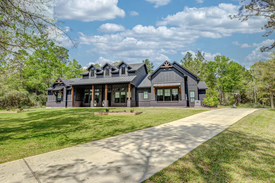 Front exterior of a new home in , Willis, TX, highlighting curb appeal (Image 22).
