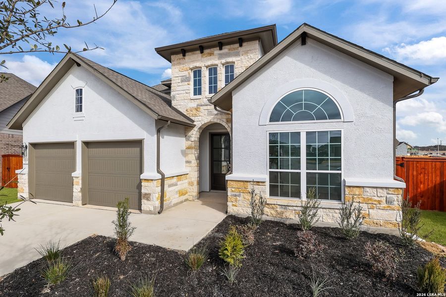 Front exterior of a new home in Megan's Landing, Castroville, TX, highlighting curb appeal (Image 23).