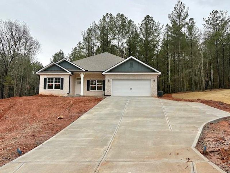 Front exterior of a new home in Eagle Heights, Maysville, GA, highlighting curb appeal (Image 1). Front exterior of a new home in Eagle Heights, Maysville, GA, highlighting curb appeal (Image 1).