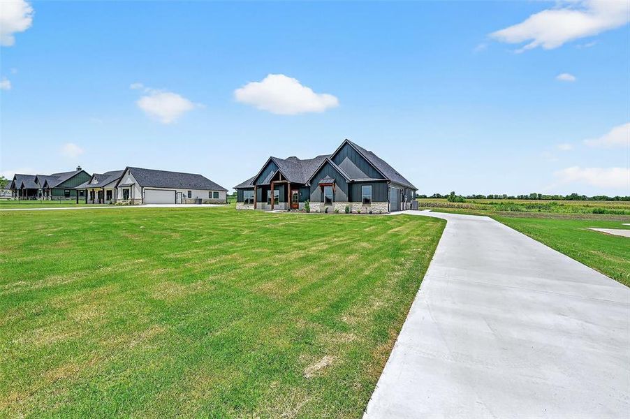 Front exterior of a new home in , Sherman, TX, highlighting curb appeal (Image 26).