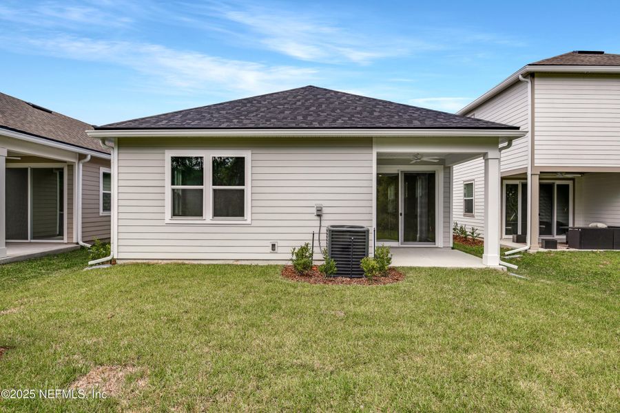 Front exterior of a new home in Elm Creek at Silverleaf, St. Augustine, FL, highlighting curb appeal (Image 12). Front exterior of a new home in Elm Creek at Silverleaf, St. Augustine, FL, highlighting curb appeal (Image 12).
