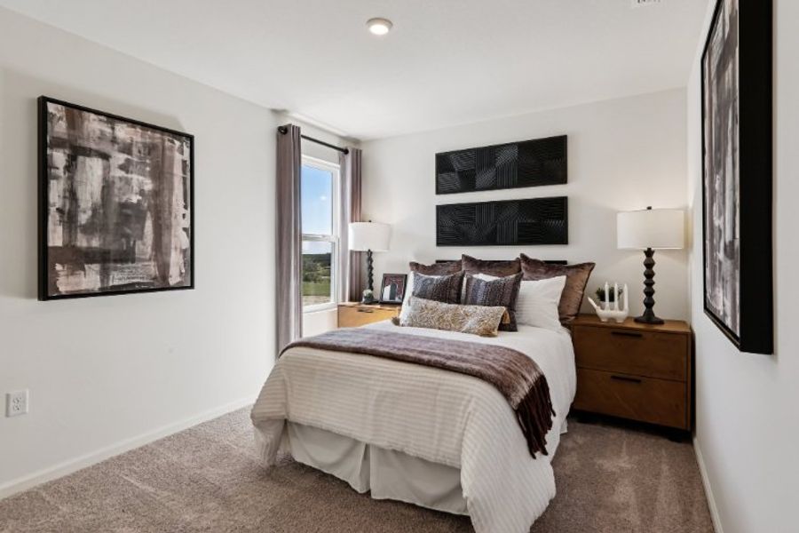 A bedroom with a bed and lamps. A bedroom with a bed and lamps.