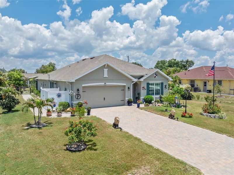 Front exterior of a new home in Burnt Store Village, Punta Gorda, FL, highlighting curb appeal (Image 22).