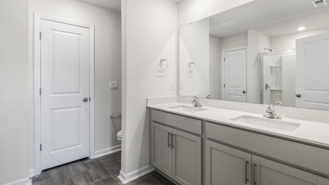 Furnished interior view inside a new home in The Townes at Ridgewood Farms, Winterville (Image 8).