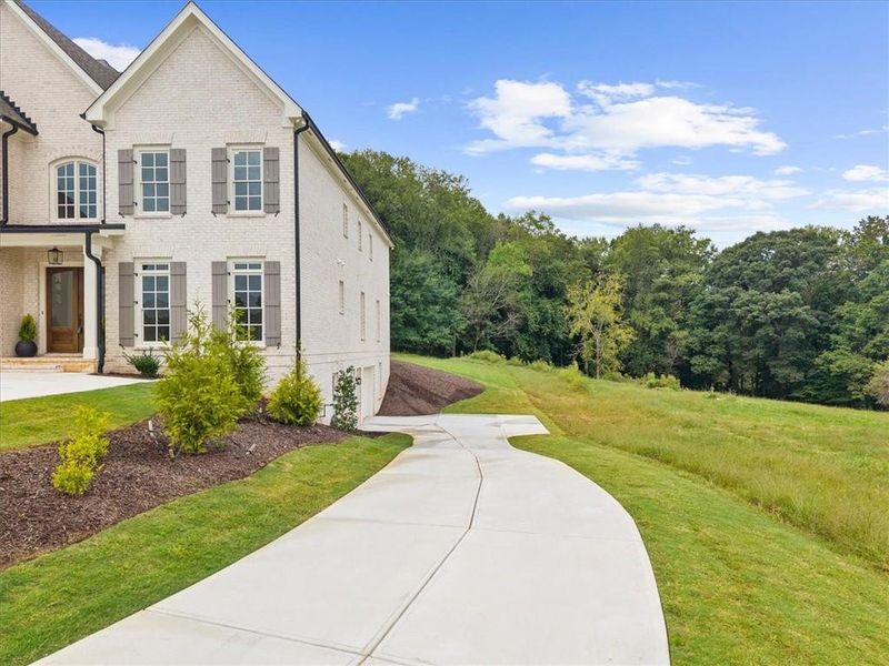 Front exterior of a new home in , Canton, GA, highlighting curb appeal (Image 27).