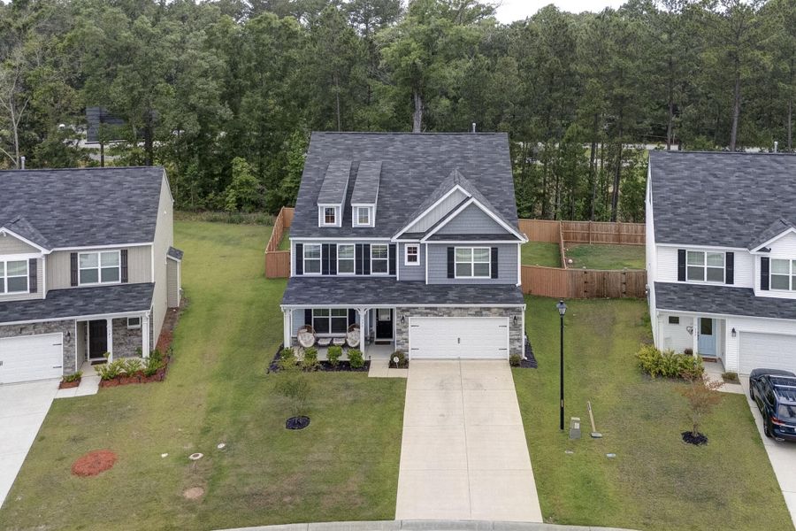 Front exterior of a new home in Oakley Pointe, Moncks Corner, SC, highlighting curb appeal (Image 26). Front exterior of a new home in Oakley Pointe, Moncks Corner, SC, highlighting curb appeal (Image 26).