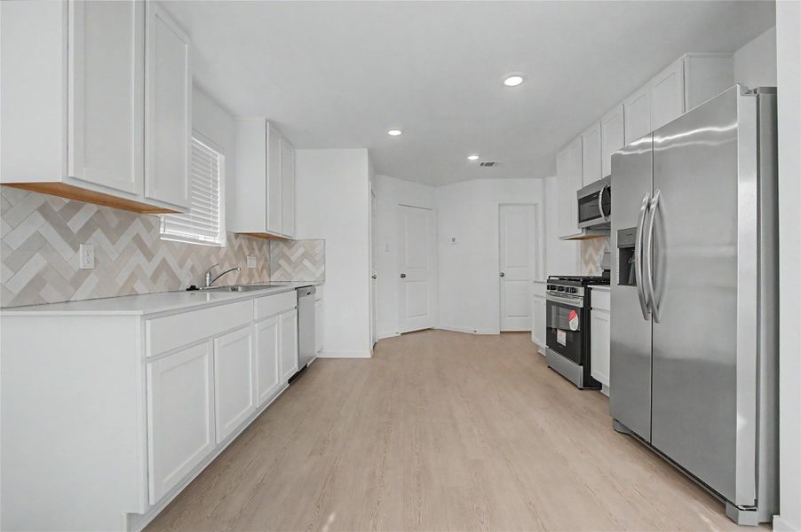 Furnished interior view inside a new home in Sunterra, Katy (Image 7).